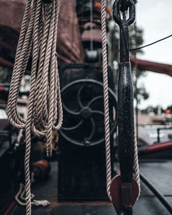 Close-up of rope hanging on boat deck