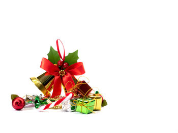 Low angle view of christmas decorations on white background