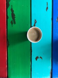 Close-up of coffee cup with closed door