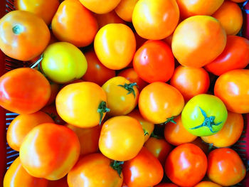 Full frame shot of fresh tomatoes for sale at market