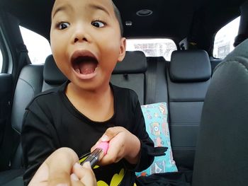 Cute girl sitting in car