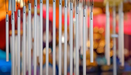 Windchimes in front of foliage background in spring soft focus