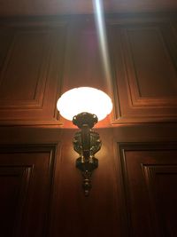 Low angle view of illuminated lamp at home