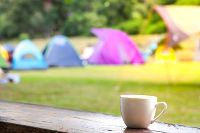Coffee cup on table in park