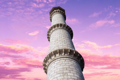 Low angle view of tower against sky during sunset