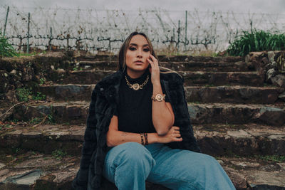 Portrait of teenage girl sitting on staircase