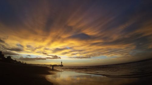 Scenic view of sea against sky at sunset