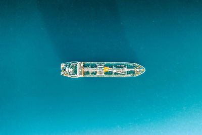 High angle view of boat on blue sea