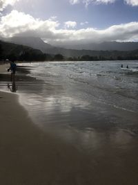Scenic view of sea against cloudy sky