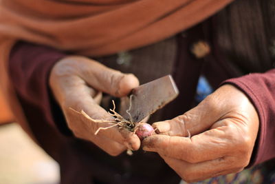 Close-up of man holding camera