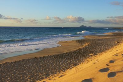 Scenic view of beach against sky