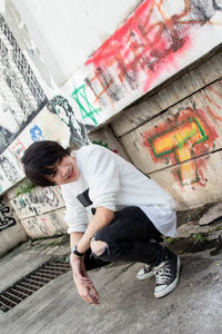 Full length of boy on wall