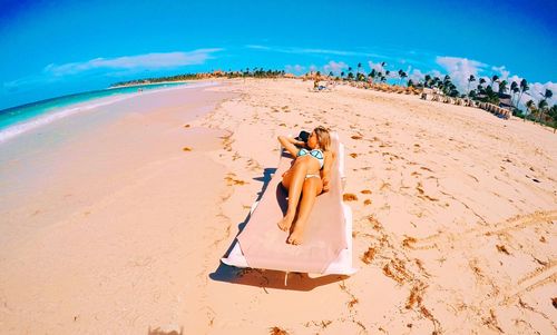 High angle view of woman relaxing on beach