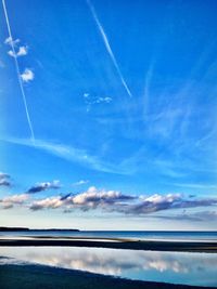 Scenic view of vapor trails in sky