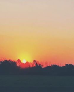 Scenic view of silhouette landscape against sky during sunset