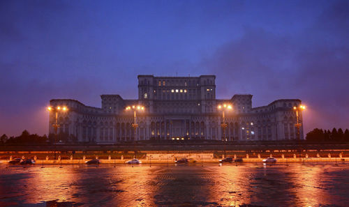 View of illuminated palace of parliament at night, bucharest - romania