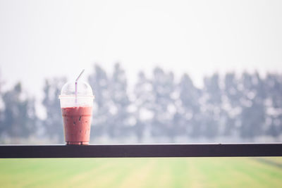 Close-up of drink against sky