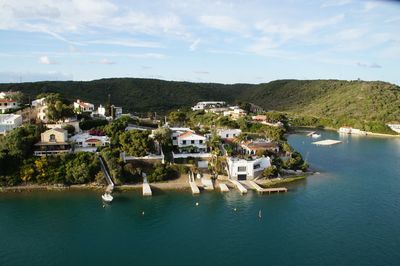 Townscape by sea against sky