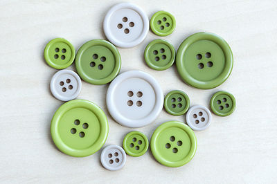 High angle view of various buttons on table
