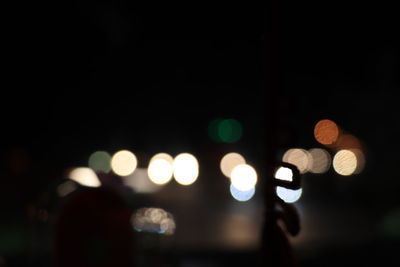 Defocused image of illuminated lights at night