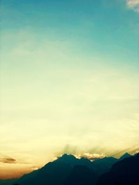 Scenic view of silhouette mountains against sky at sunset