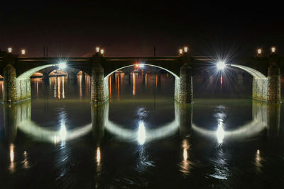 View of illuminated bridge at night