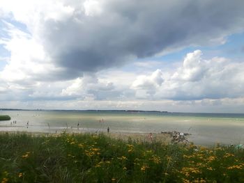 Scenic view of sea against cloudy sky