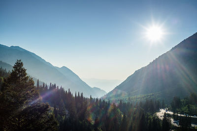 Scenic view of mountains against sky on sunny day