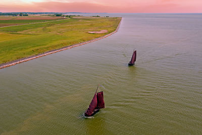 Aerial from traditional dutch wooden boats at the ijsselmeer in friesland the netherlands