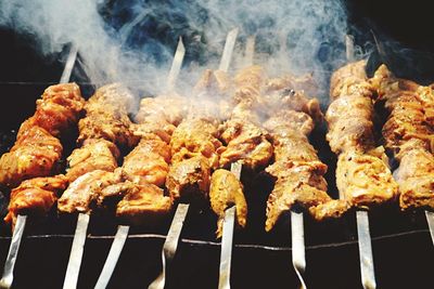 Close-up of meat on barbecue grill