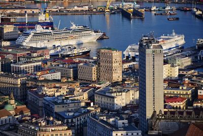 High angle view of harbor by buildings in city