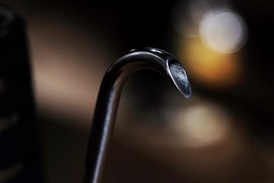 Close-up of faucet in water