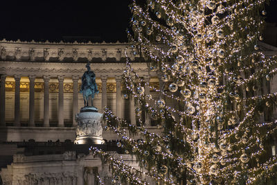 Low angle view of illuminated building at night