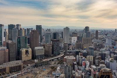 High angle view of buildings in city against sky