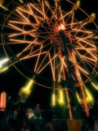 Low angle view of firework display at night