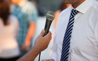 Close-up of man using mobile phone