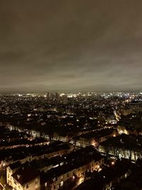 High angle view of illuminated city buildings against sky