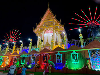 Illuminated buildings in city at night