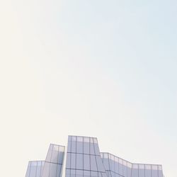 Low angle view of modern building against clear sky