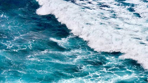 High angle view of waves on sea