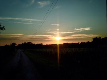Scenic view of field against sky during sunset
