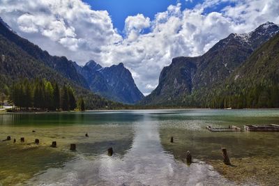 Scenic view of lake and mountains against sky