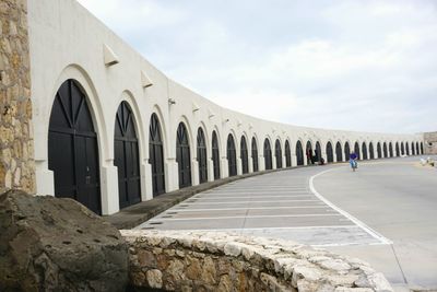 Corridor of building against sky