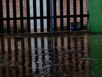 Reflection of building on puddle