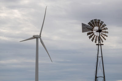 Low angle view of windmill against sky