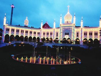 View of illuminated building in city