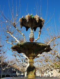 Low angle view of statue against clear blue sky