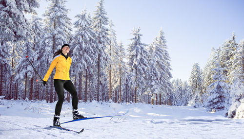 Full length of man walking on snow covered land