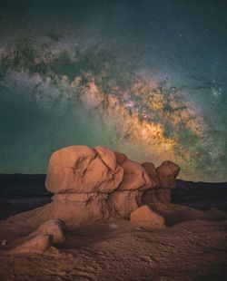 Rock formation on land against sky