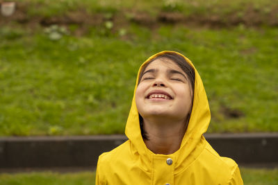 Portrait of smiling girl standing outdoors